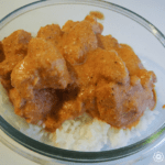 Scratch butter chicken recipe (plated with sauce and basmati rice) from Rosette Fair Trade
