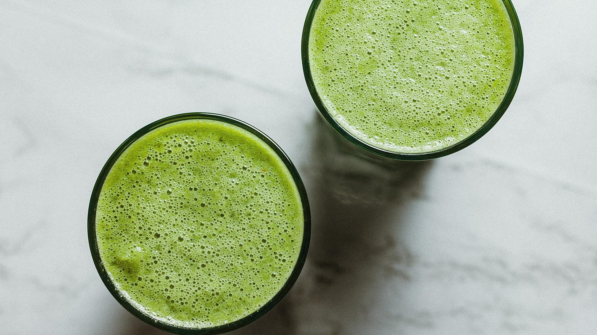 Green Sunshine smoothie recipe on the Rosette Fair Trade blog (overhead shot of glasses)